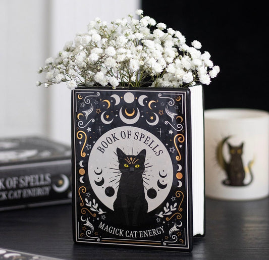 Jarrón de flores con forma de libro de magia de gato negro