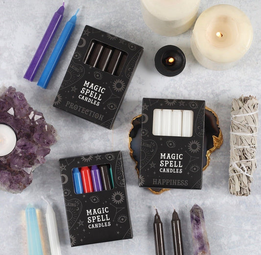 Paquete de 12 velas rituales disponibles en diferentes colores, cada uno con una intención específica
