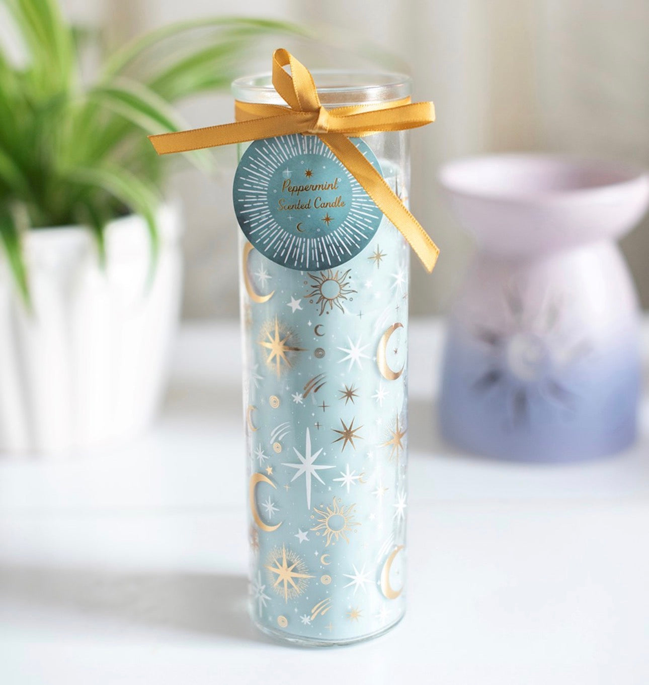 Vela tubo con diseño de cielos azules pastel