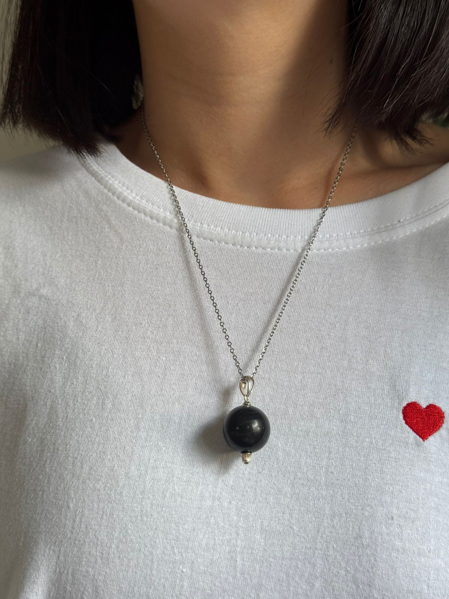 Colgante bola de shunguita en plata