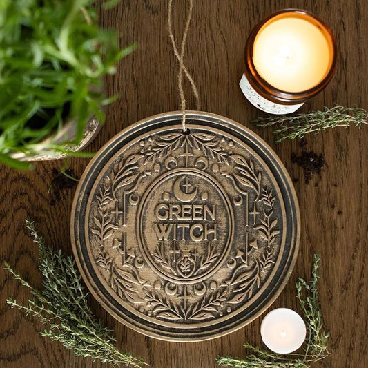 Placa colgante de terracota con efecto bronce de la bruja verde.