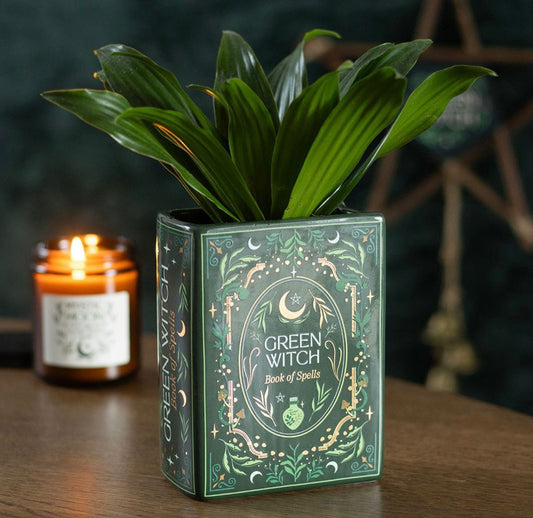 Jarrón con forma de libro de la bruja verde.