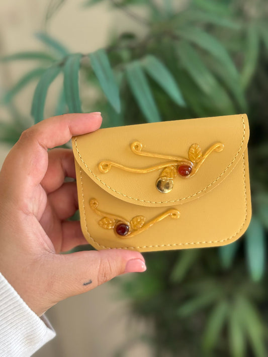 Monedero amarillo solar encantado