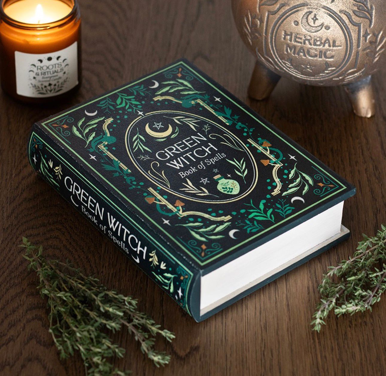 Caja de almacenamiento con forma de libro de la bruja verde.