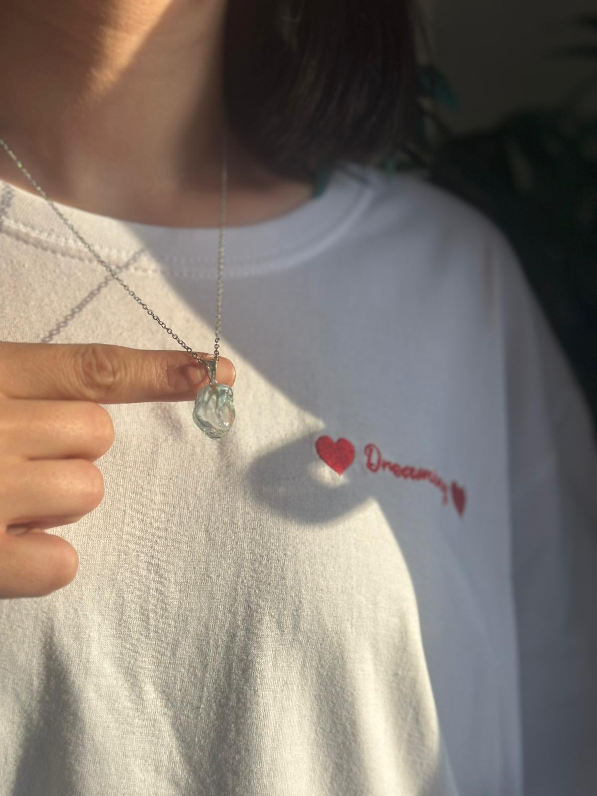 Colgante de plata con topacio azul rodado